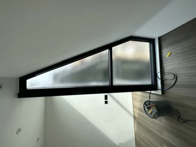 Triangular black aluminium apex glazing in London loft conversion