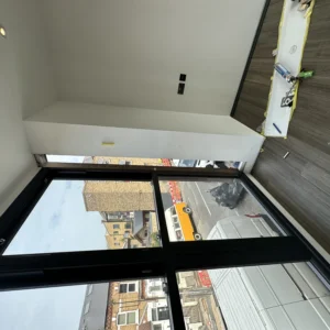 Black aluminium picture window over London street view