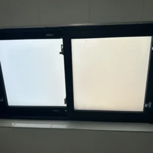 Black aluminium frosted tilt-turn window in London bathroom