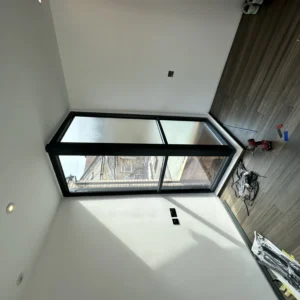 Black aluminium box bay window in London loft room