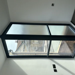 Black aluminium frosted casement window in London loft bathroom