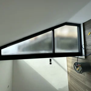 Apex black aluminium frosted gable window, London loft bathroom