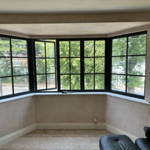 Black aluminium Crittall-style bay window in London lounge