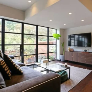 Black aluminium floor-to-ceiling windows in London living room