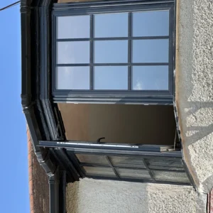 Anthracite aluminium bay window mid installation, London house