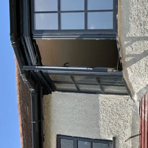 Grey aluminium bay window installation, London terraced house