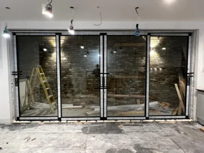 Black aluminium bifold doors installed in London property