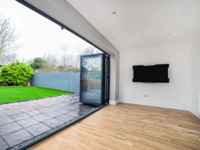 Open aluminium bifold doors to garden, London extension