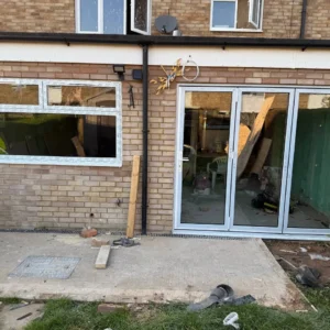 White uPVC bifold doors installation, London rear extension