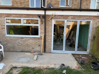 White uPVC bifold doors installation, London rear extension