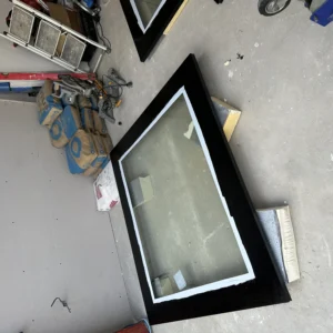 Sealed glazed units awaiting installation in London workshop