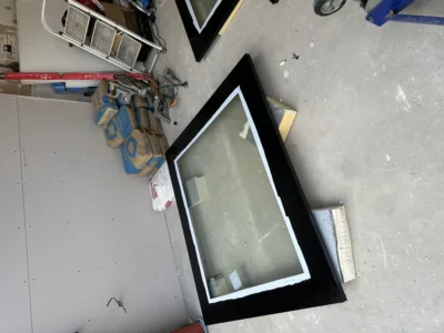 Sealed glazed units awaiting installation in London workshop