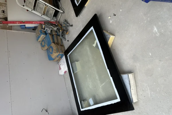 Sealed glazed units awaiting installation in London workshop