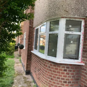 White uPVC bay casement windows on London brick house