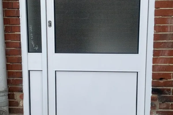 White uPVC glazed utility door installation, London