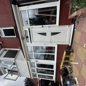 White uPVC front door and bay window, London house front