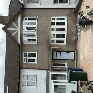 London semi-detached house exterior with white uPVC bay windows