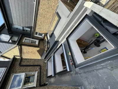 London rear extension with grey aluminium windows, rooftop view