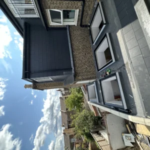 London rear extension white aluminium windows, garden view