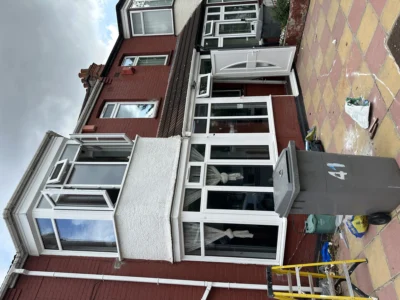 London house with white uPVC bay windows and porch