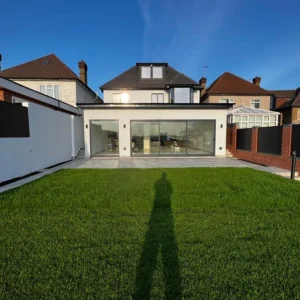 White rendered London rear extension with bifold doors