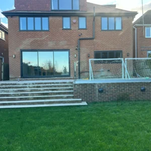 London rear elevation with sliding doors and glass balustrade
