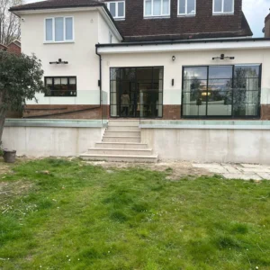 London rear extension with Crittall windows and glass balustrade