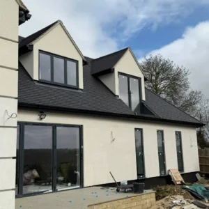 Rear of new build house with anthracite glazing, London