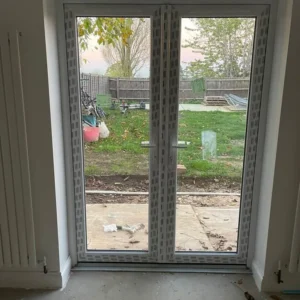White uPVC French doors to London garden, newly installed