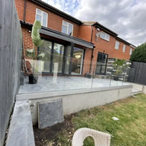 Frameless glass balustrade on raised London garden terrace