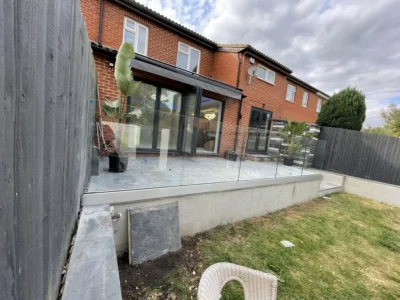 Frameless glass balustrade on raised London garden terrace