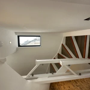 Glass staircase balustrade and window in modern London home