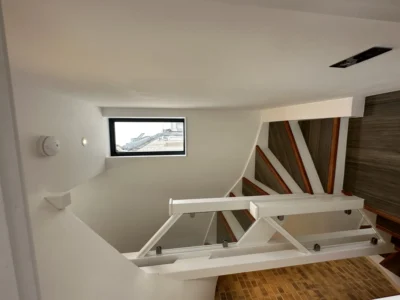 Glass staircase balustrade and window in modern London home