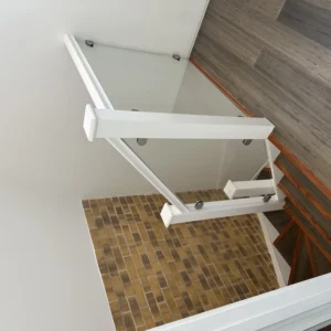 Frameless glass balustrade on white staircase, London home