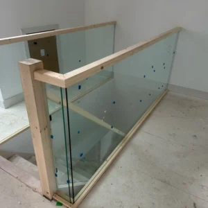 Frameless glass balustrade with timber posts, London home