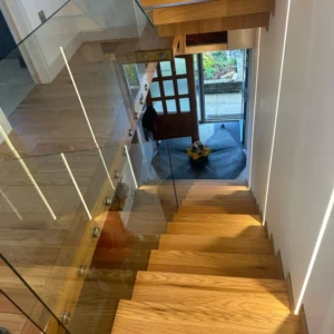 Frameless glass balustrade on London oak staircase