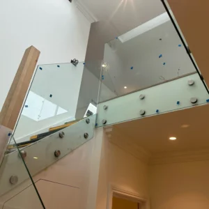 Frameless glass landing balustrade in London new build