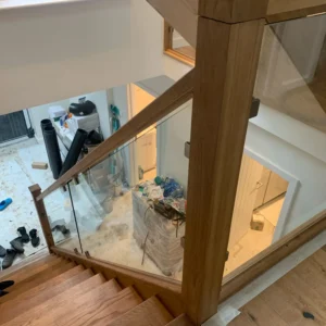 Frameless glass balustrade over London staircase void