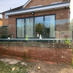 Frameless glass balustrade on London raised garden patio
