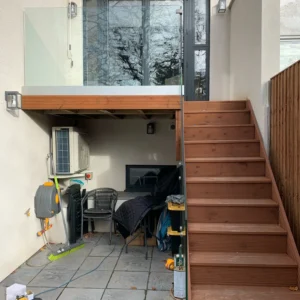 Frameless glass balustrade on London raised deck steps