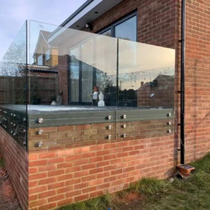 Glass balustrade with steel posts on terrace, London