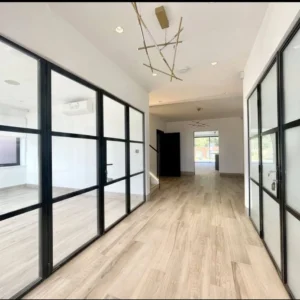 Black framed glass partition hallway, London