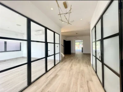 Black framed glass partition hallway, London