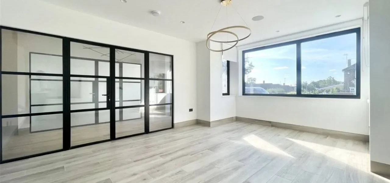 Black Crittall glass partition doors in London room
