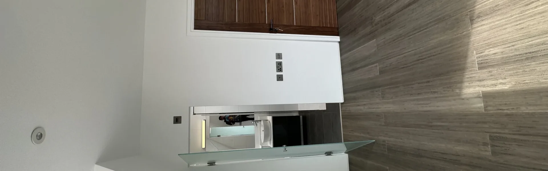 Frosted glass splashback in contemporary London kitchen