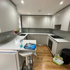 Finished London kitchen with grey glass splashback