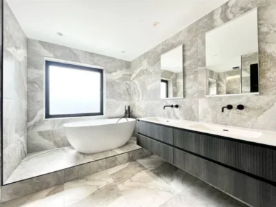Bathroom wall mirrors above twin vanity, London