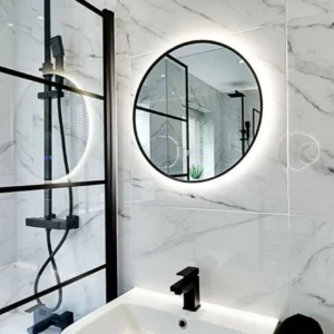 Round backlit bathroom mirror with black shower screen, London