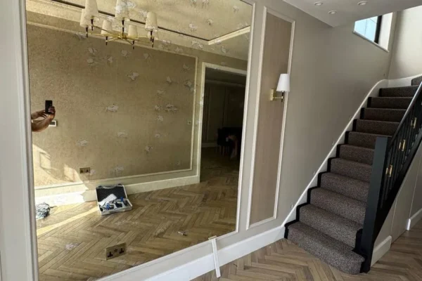 Large bespoke wall mirror in London hallway