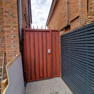 Red timber-effect metal side gate London property